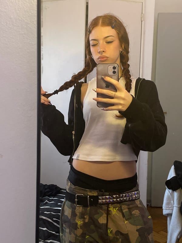 Woman films tooth-brushing selfie with cracked phone in Buenos Aires