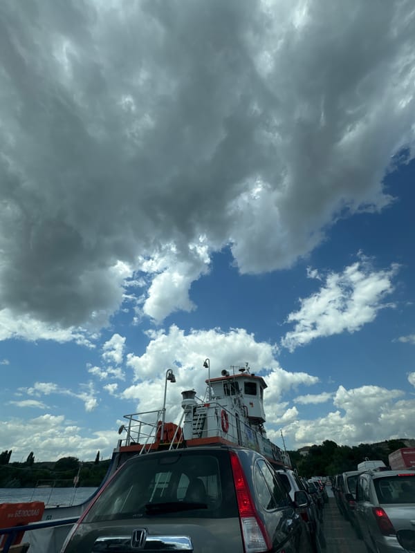 Car ferry crossing Beloslav Lake on a summer afternoon