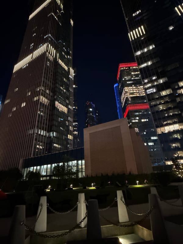 Moscow City towers glow at night from multiple angles