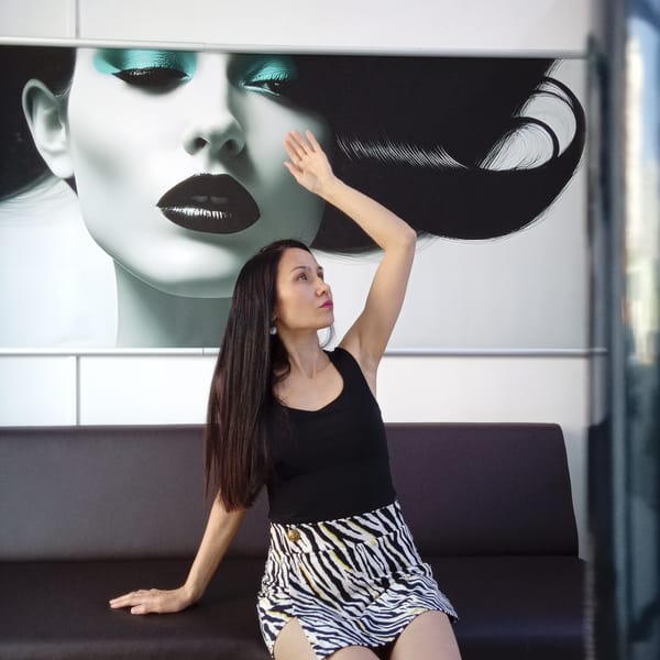Woman in zebra-print skirt sits on sofa in Izhevsk