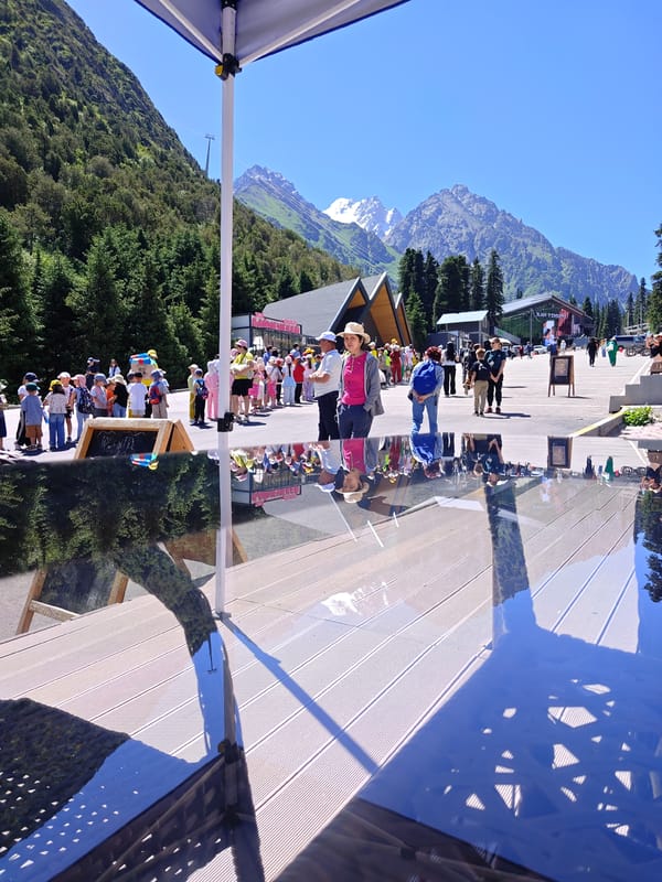 Kids hiking in line through a sunny mountain destination