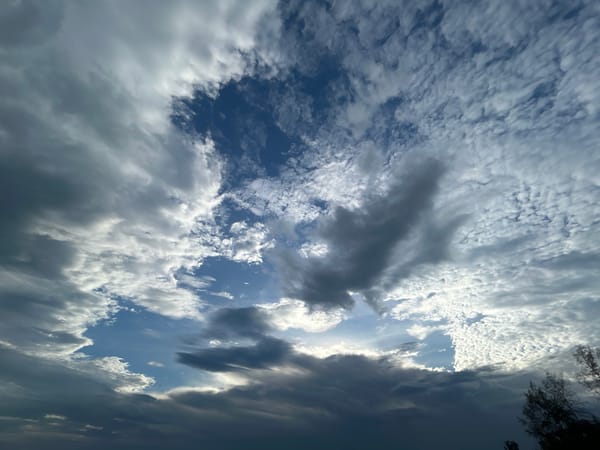 Dramatic skies and weathered boats captured on Koh Phangan shores