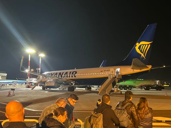 Nighttime passenger boarding at Rome Ciampino Airport