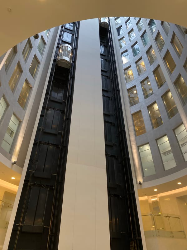 Glass elevator viewed from below in a Saint Petersburg atrium