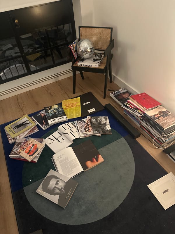 London resident enjoys evening reading session with art magazines, tea
