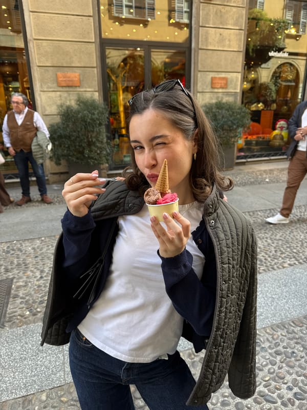 Woman photographed outside chocolate shop in Milan street scene