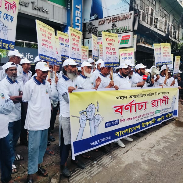 Men in white shirts hold street rally in city