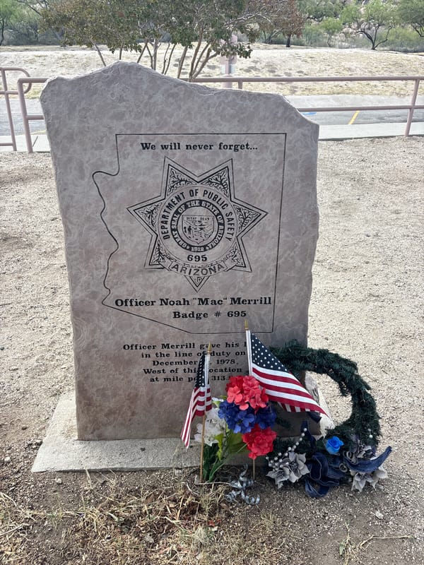 Roadside stop in Dragoon, Arizona with trail signs and memorial