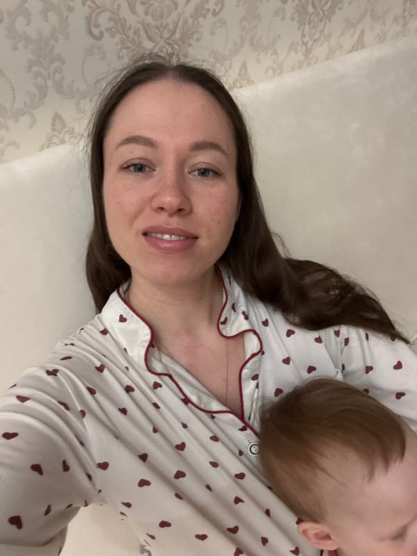 Mother and toddler share quiet afternoon reading, playing at home