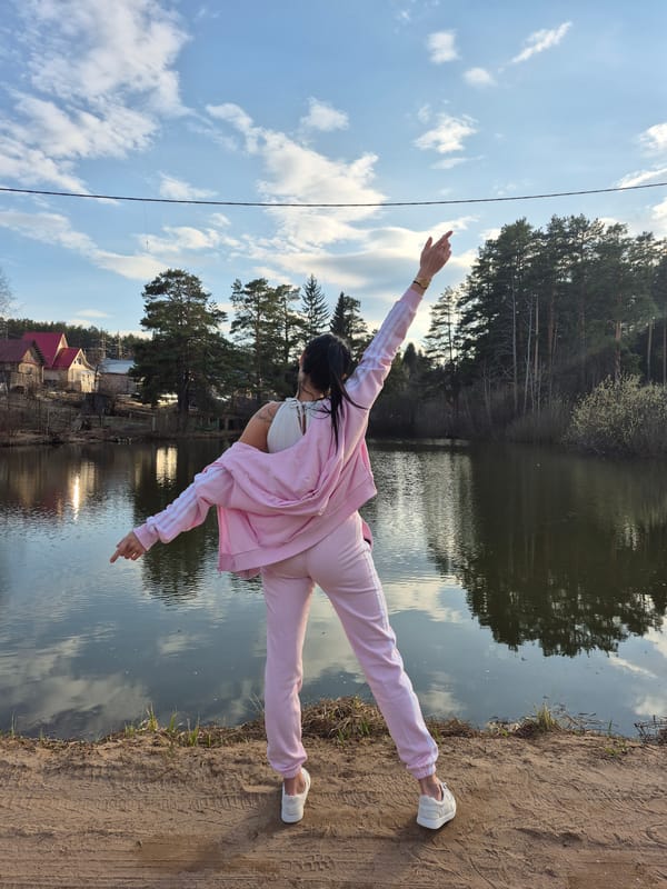 Group photography session along Chaikovsky waterfront captures spring afternoon