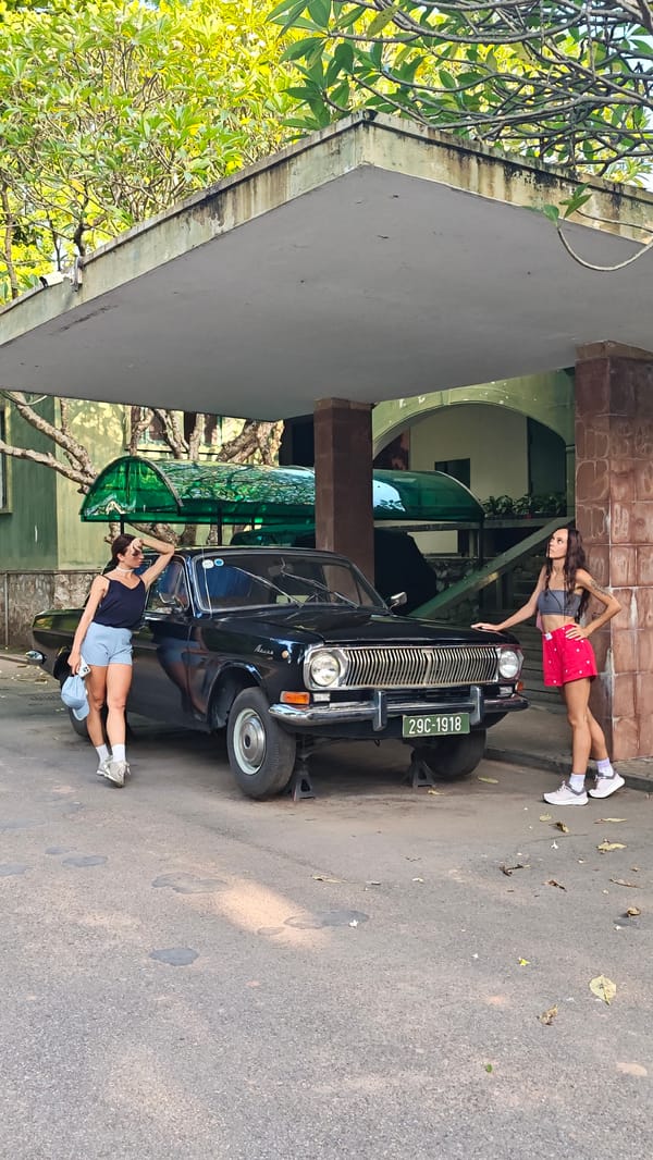 Tourists explore historical sites and vintage vehicles in Hà Nội