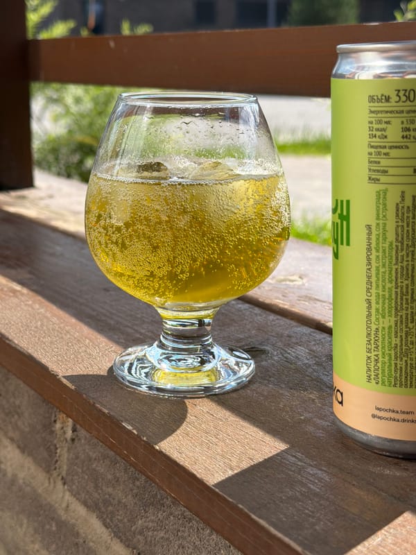 Sparkling yellow drink and LAPOCHKA TARHUN can in Strelna