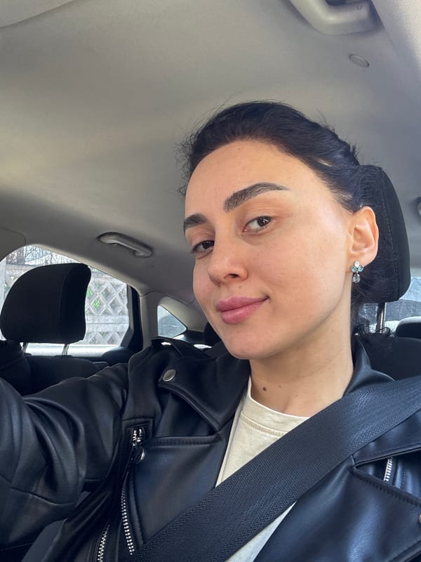 Woman takes playful car selfies while traveling through Tbilisi