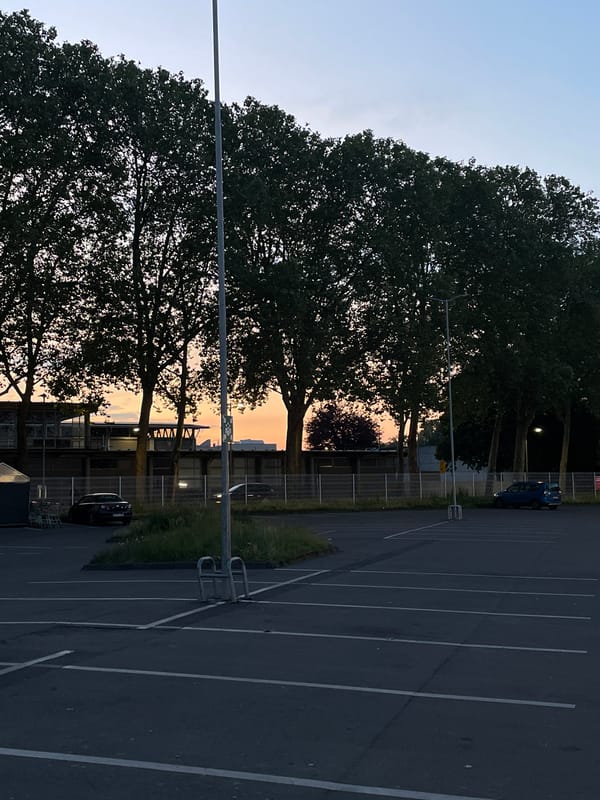 Evening drive through Siegburg past the landmark clock tower