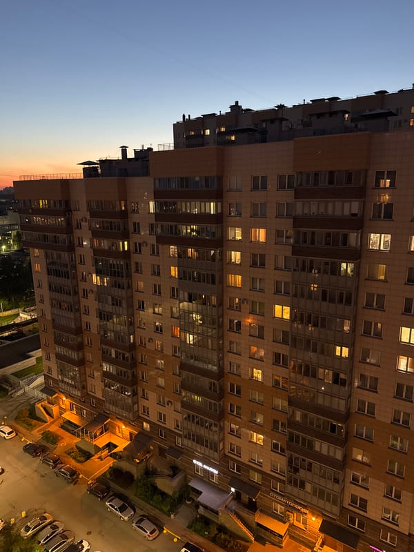 Modern residential building photographed at twilight in Russia