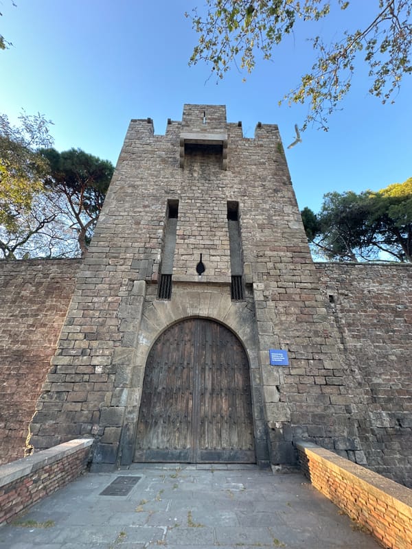 Tourist captures Barcelona castle and waterfront views Saturday evening