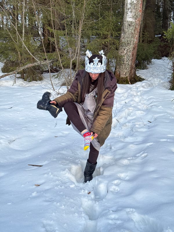 Woman plays with decorated eggs in snowy Russian village