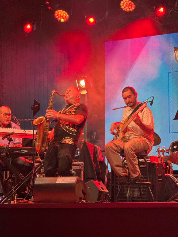 Live band performs under red stage lights in Tivat, Montenegro