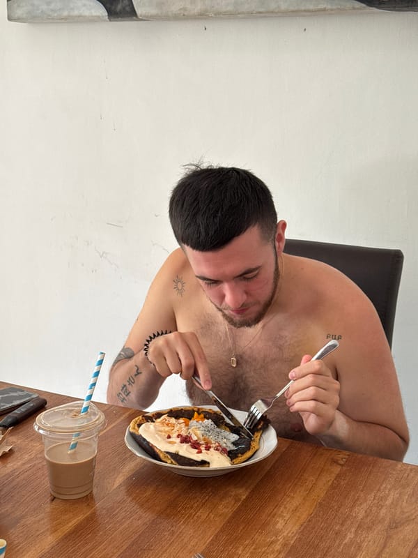 Lazy Bali breakfast morning with coffee, food, and a dog