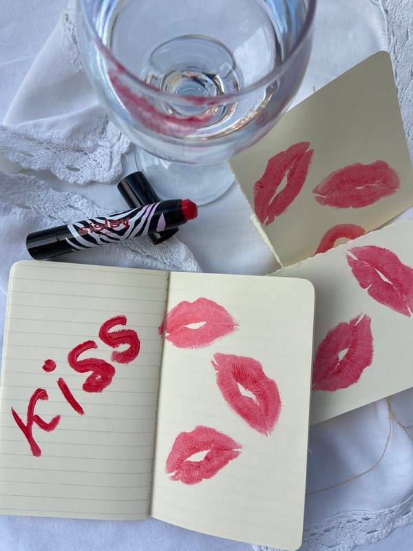 Artist documents lipstick kiss impressions in Budva, Montenegro