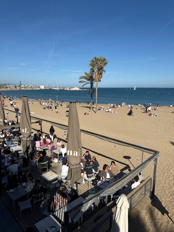 Busy afternoon beach scene captured in Barcelona, Spain