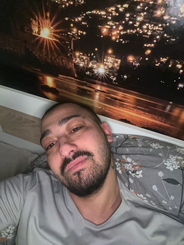 Man resting in bedroom in Shumata, Bulgaria