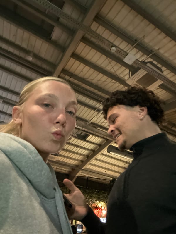 Friends take selfies at dartboard arcade in Villeneuve-d'Ascq
