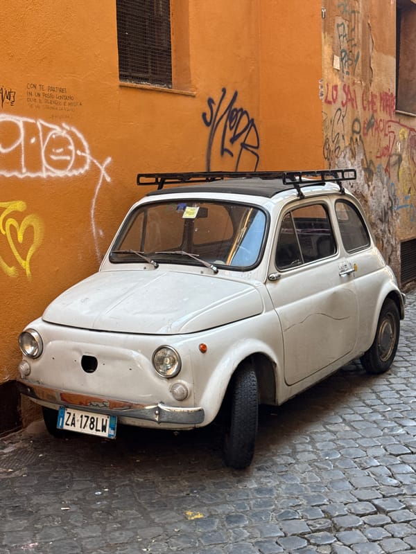 Witness captures typical Roman street scene with parked Fiat