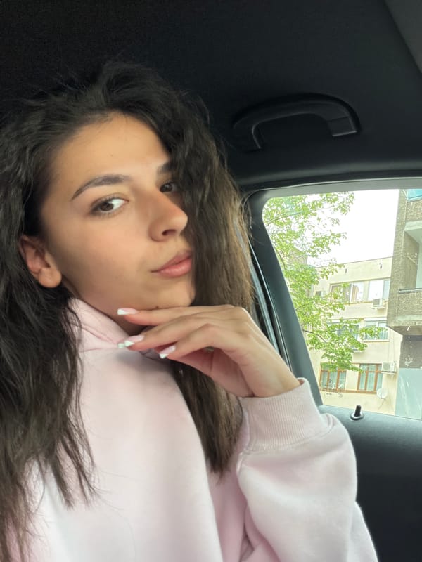 Woman rests in car backseat in Gabrovo, Bulgaria