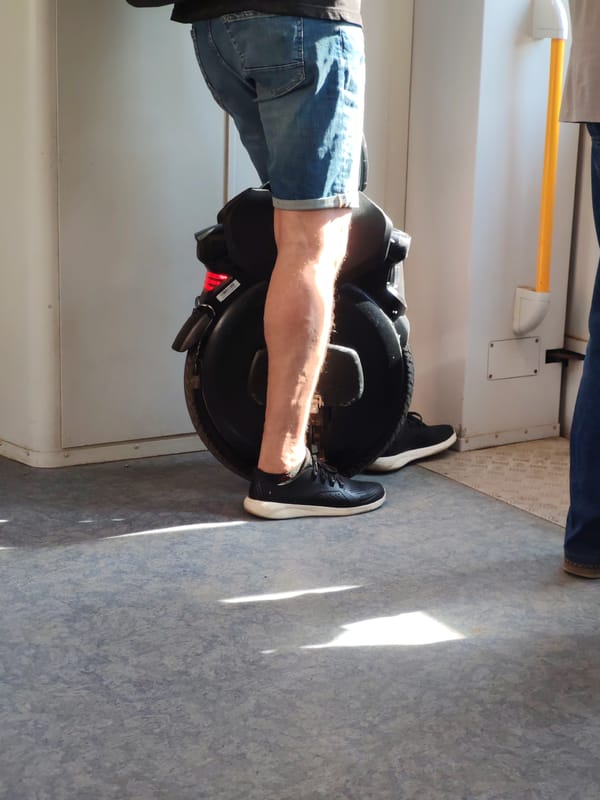 Man rides electric unicycle inside Moscow train car