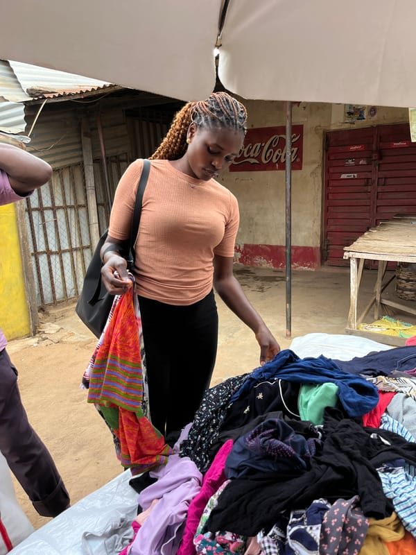 Busy afternoon at secondhand clothing market in Gura Top