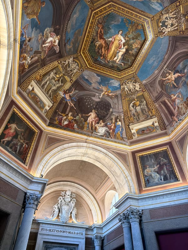 Ornate painted ceiling captured in Vatican City building