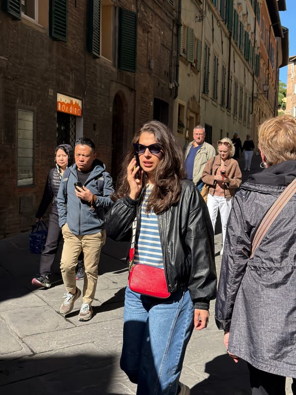 Morning tourist activity captured in historic Siena streets