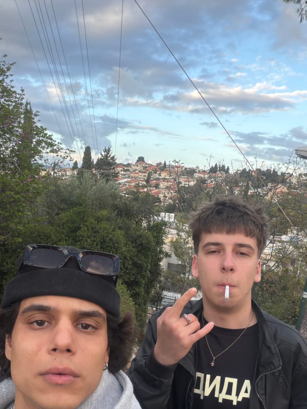 Young men take selfie in Yokneam Illit cityscape