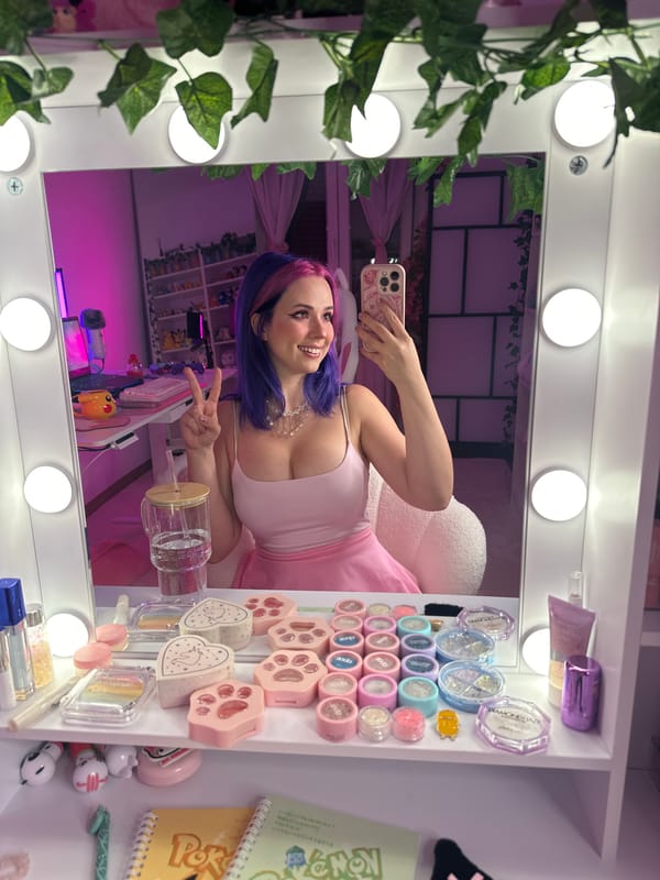 Selfie session in a cozy, pink-themed bedroom in Oviedo