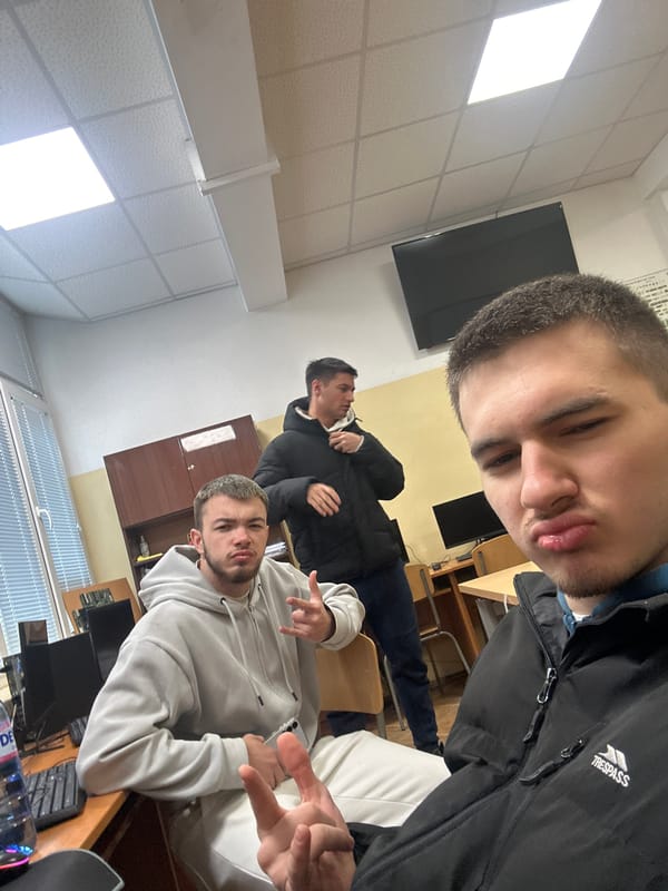 Three men gathered in indoor setting in Sofia