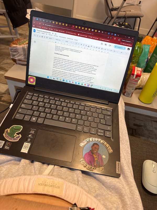 Home workspace documented in Hull showing laptop and cluttered desk