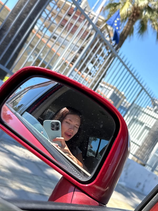 Woman photographed in car with smartphone in Larnaca