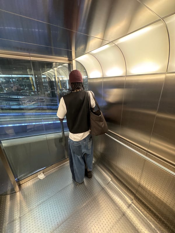 Man stands in metallic transit tunnel in Madrid