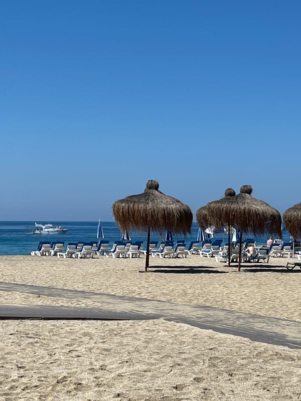 Morning stroll captured on sunny Alanya beach promenade