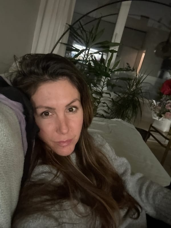 Woman photographed in Sofia apartment interior at night