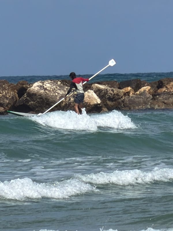 Morning fishing and breakfast scenes captured in Tel-Aviv
