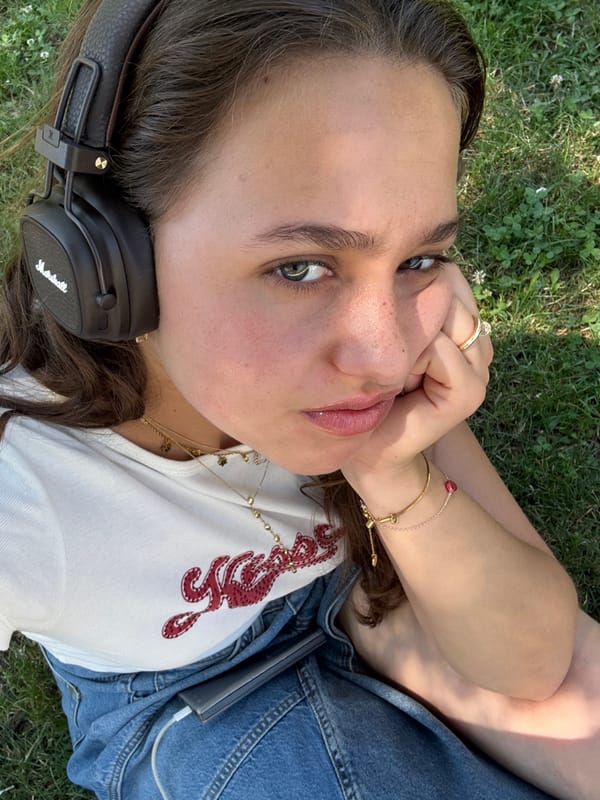Woman relaxes with headphones in Milan park