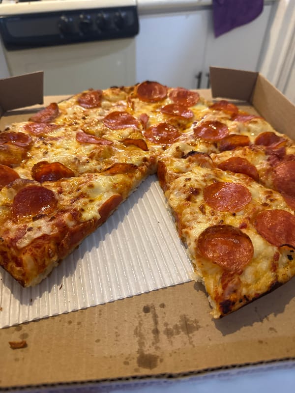 Half-eaten pepperoni pizza documented in Puebla early morning