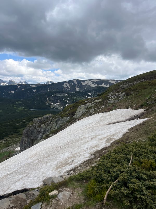 Rila Mountains in transition: snow, wildflowers, chairlifts, and trail dogs