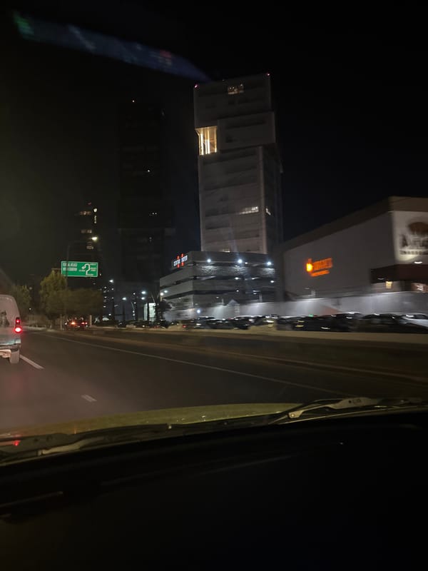 Night skyline view captured from vehicle in Puebla