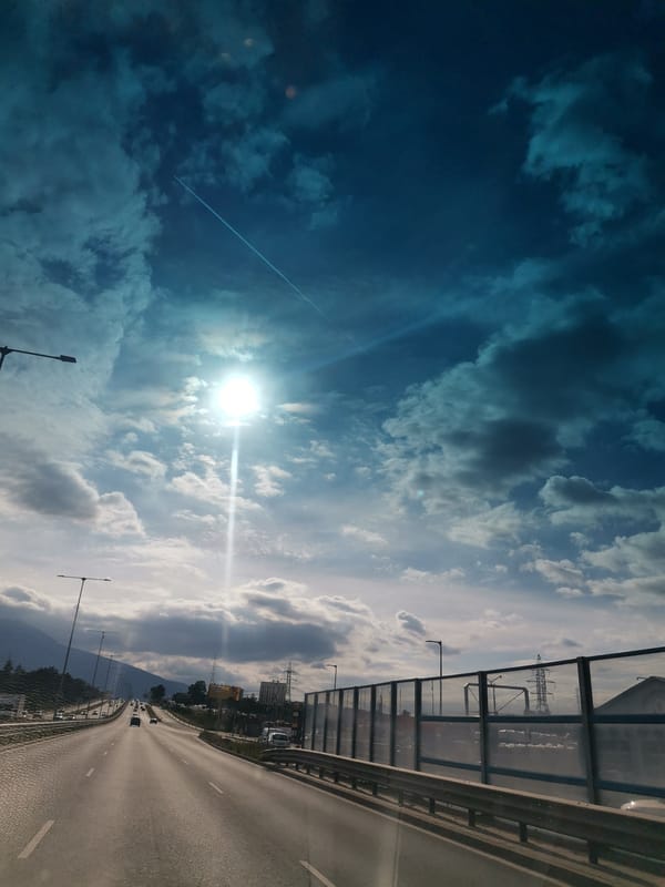 Driver documents highway journey through Sofia under dramatic skies