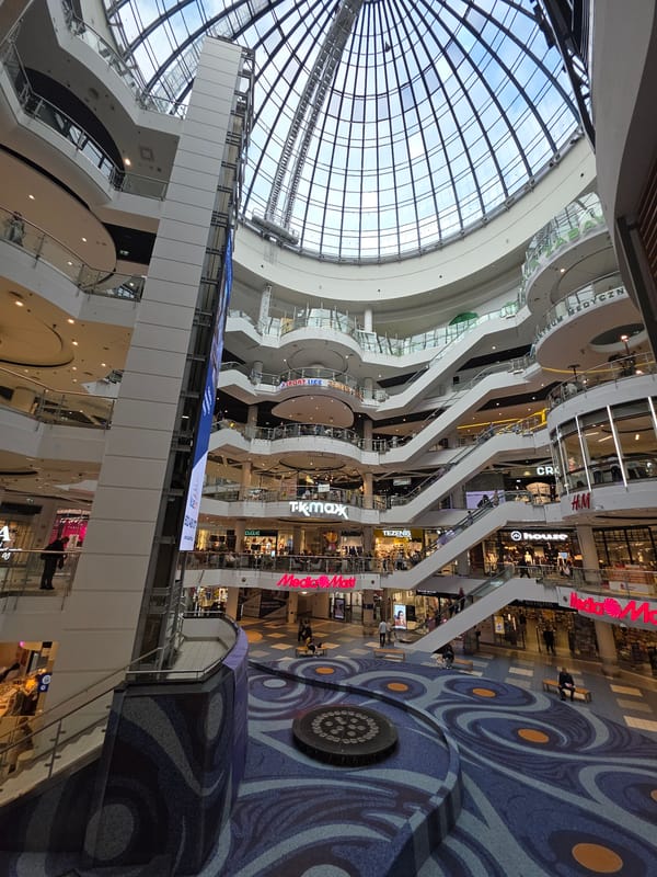 Shopping mall visit captures architecture, vendors, jewelry, flowers in Warsaw