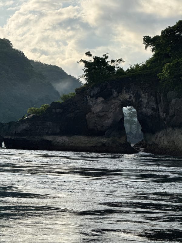 Natural cliff archway photographed off Nusa Penida coast