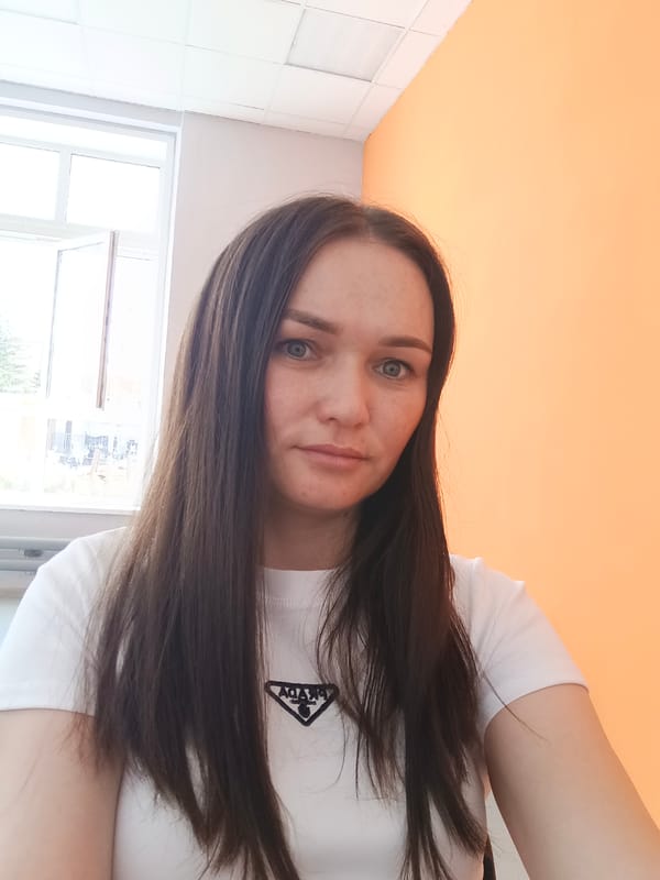 Woman Takes Indoor Selfie in Prada Shirt in Ufa